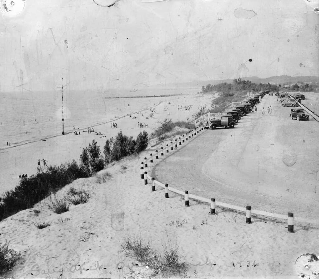 Historic black-and-white photo of the Oval Beach shoreline and dunes